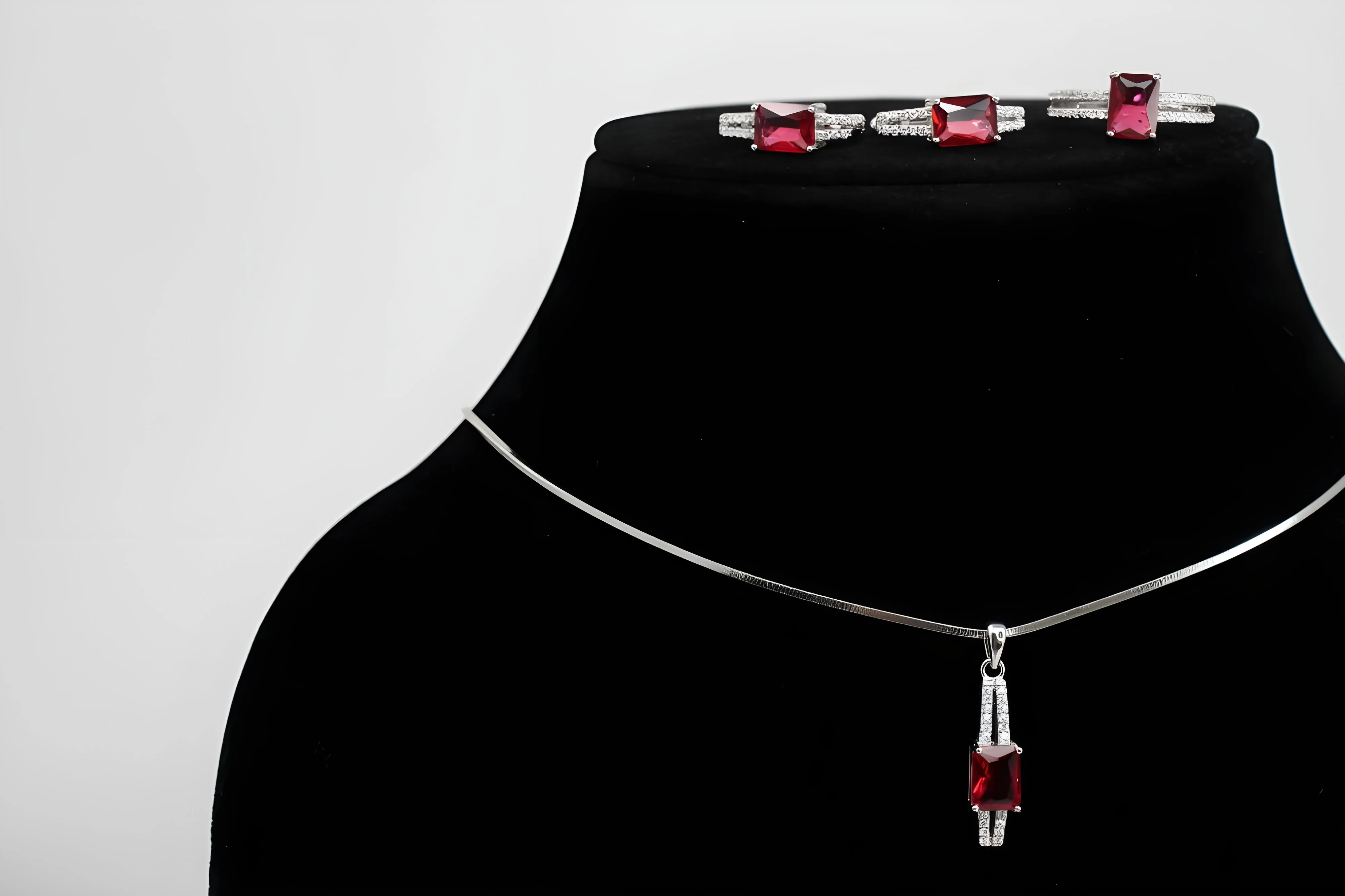 Ruby Radiance Diamond Jewelry Set - Sterling Silver Ring, Pendant & Drop Earrings with Rectangular-Cut Rubies and White Diamond Accents